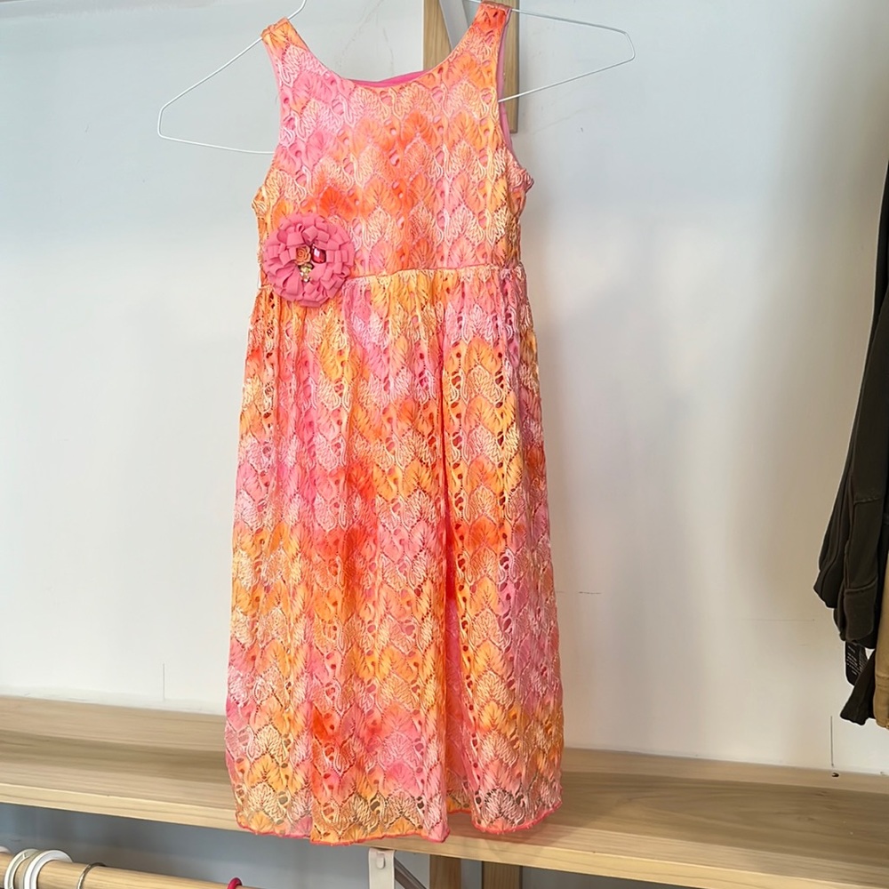 Girls dress size 6x. Beautiful pink/ tangerine colors. Cachcach boutique